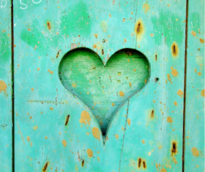 heart in middle of wooden board