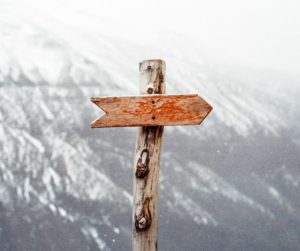 perfect plan - directional sign that looks like a cross