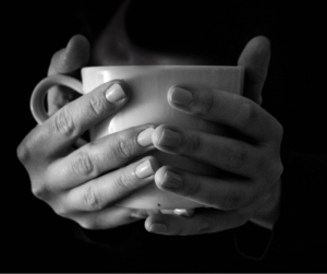 hands around hot mug